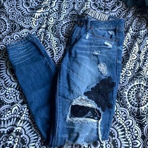 Distressed lace jeans